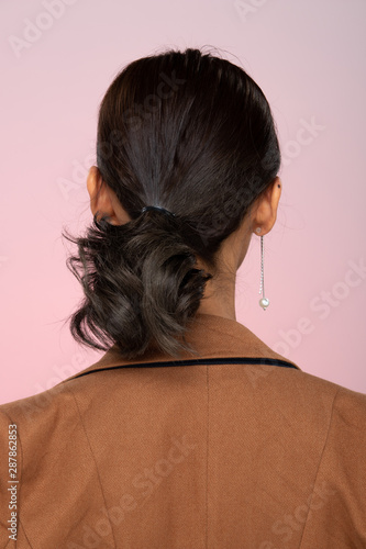 Back Side View Of Women To Show Short Tie Black Hair Style