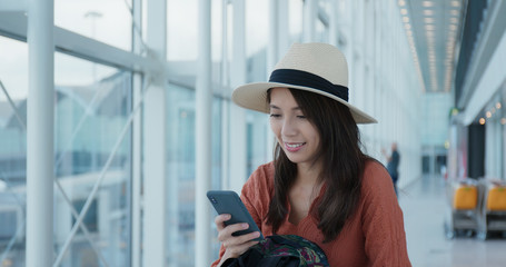 Canvas Print - Woman use of mobile phone in the airport