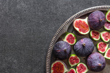 Wall Mural - Fresh figs slices. Purple fig fruits, top view.