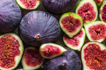 Wall Mural - Background of figs. Fresh, juicy ripe fig fruits slices.