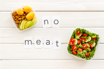 Wall Mural - Healthy dinner in lunch box and no meat text on white wooden background top view