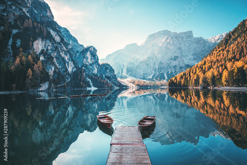 Naklejka dekoracyjna Boats on the Braies Lake ( Pragser Wildsee ) in Dolomites mountains, Sudtirol, Italy