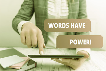 Writing note showing Words Have Power. Business concept for as they has ability to help heal hurt or harm someone Business concept with mobile phone in the hand