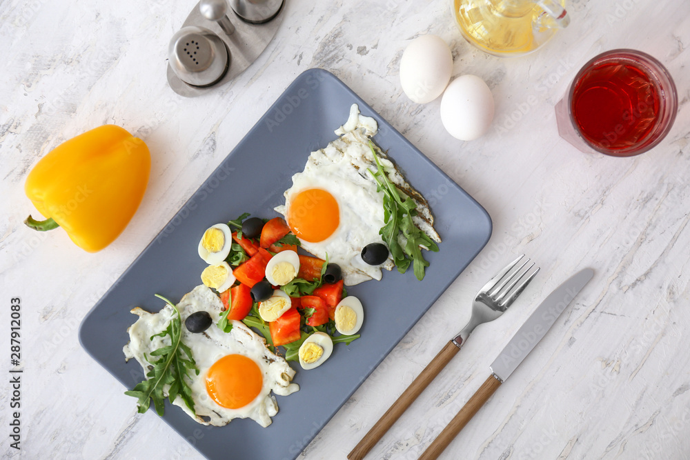 Plate with tasty salad on table