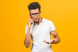 © denis_vermenko - Young african american man using smartphone stressed, shocked with shame and surprise face, angry and frustrated. Fear and upset for mistake.