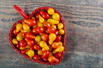 Canvas Print - cherry tomatoes red and yellow on wooden background