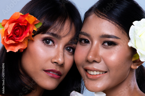 diversity of multinational women together for portrait beauty fashion style arab indian and asian women black hair are close friends look at camera for photo shooting in studio blue background buy adobe stock
