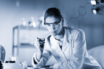 Fototapete - Portrait of a confident female health care expert in life science laboratory writing structural chemical formula on a glass board. Healthcare and modern life science concept. Blue toned image.