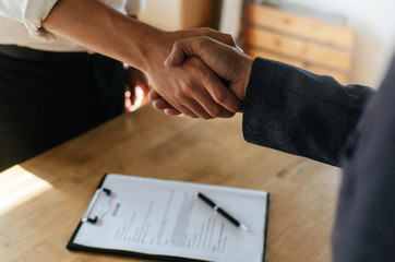Wall Mural - Partnership. two business people shaking hand after business signing contract in meeting room at company office, job interview, investor, success, negotiation, partnership, teamwork, financial concept