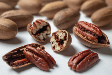 Wall Mural - Group of pecan nuts on the white background