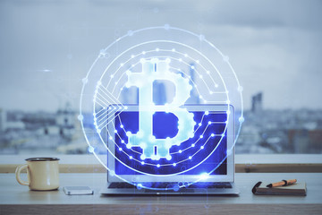 Double exposure of blockchain and crypto economy theme hologram and table with computer background. Concept of bitcoin cryptocurrency.