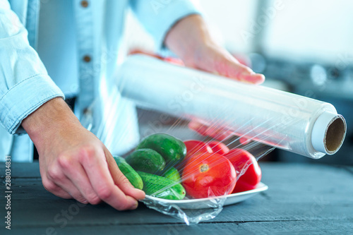 Cuadros en Lienzo Using food film for food storage in fridge