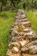 Italy, Apulia, Province of Barletta-Andria-Trani, Andria. Old stone wall near Castel del Monte.