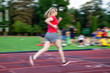 © Melinda Nagy - young woman on running track motion blur