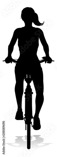 A woman bicycle riding bike...