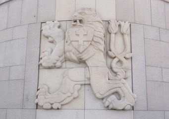 Historical memorial with Lion - symbol of Czech Republic and former Czechoslovakia. National symbol and coat of arms on marble and stone.