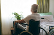 © WavebreakMediaMicro - Male patient  looking outside the window while sitting in wheelchair
