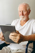 © WavebreakMediaMicro - Senior male patient using digital tablet at retirement home