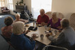 © WavebreakMediaMicro - High angle view of group of senior friends having breakfast on dining table