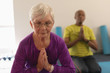 © WavebreakMediaMicro - Senior woman doing yoga in fitness studio