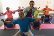 © WavebreakMediaMicro - Young female trainer assisting senior man in fitness studio