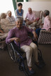 © WavebreakMediaMicro - Disabled senior woman smiling in living room