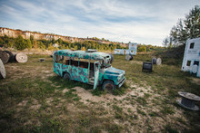 Old Abandoned Bus Green In The Field