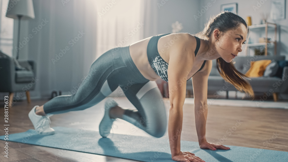 Profile Shot of a Beautiful Confident Strong Fitness Female in a Grey Athletic Outfit Doing Mountain Climber Exercises in Her Bright and Spacious Apartment with Cozy Minimalistic Interior. - obrazy, fototapety, plakaty 