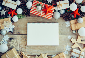 Wall Mural - Christmas background with letter and gift boxes on the wooden ta
