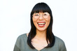 © Bonninstudio/Stocksy - Portrait of a Chinese woman over white background.
