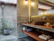© Bisual Studio/Stocksy - Luxury bathroom with a monstera plant in a villa, Bali