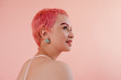 © Sergey Filimonov/Stocksy - Portrait of teen girl with pink hair and tattoos