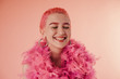 © Sergey Filimonov/Stocksy - Cheerful lady in pink neckpiece