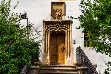 Wall Mural - Medieval wooden door with old circle shaped metal door knocker