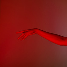 Conceptual Photo, Elegant Female Hand In Red Light