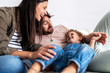 © Santi Nunez/Stocksy - Adorable happy family having fun at home