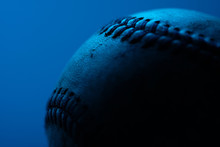 Close Up Of Old Baseball Under Blue Gel With Copy Space For Sports Background.