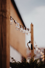 Decorative Outdoor String Lights Hanging Outdoor At The Evening.