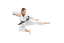 Man Exercising Karate, Kick In The Air Against White Background