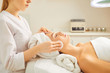 © Studio Romantic - Beautician makes cleaning the face of a woman in the cosmetology office.