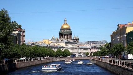 Wall Mural - View of Moika river, domes of St. Isaac's Cathedral and tourist boats, St. Petersburg, Russia