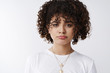 © Cookie Studio - Girl cannot find people come celebrate pride together. Silly sulking cute curly-haired woman feel regret disappointment pouting frowning complain unlucky day standing white background pitty