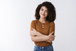© Cookie Studio - Tender attractive young alluring curly-haired nice girl smiling feel warmth care hugging herself standing comfort grinning joyfully enjoying relaxing romantic moment, white background