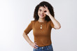 © Cookie Studio - Positive good-looking optimistic girl curly dark hairstyle showing ok perfection delight gesture smiling approving excellent idea show okay gesture eye grinning, white background