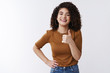 © Cookie Studio - Good thanks. Happy charismatic laughing young attractive girl curly dark hair show thumb up smiling satisfied approve awesome great deal like cool choice picking outfit friend date, white background