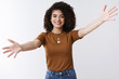 © Cookie Studio - Come into arms. Sweet tender friendly stylish girl meet friend wanna cuddle inviting hug spread arms sideways smiling broadly waiting girlfriend embraces, standing delighted relaxed white background