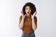 © Cookie Studio - Wait sec what. Shocked impressed speechless young good-looking girl receive unexpected promosion look surprised drop jaw waving hands worried thrilled standing stunned amazed white background