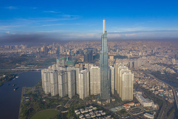 Landscape Ho Chi Minh city take by drone on the sunset with building , downtown street and public transport - at Viet Nam