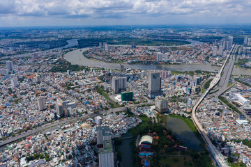 Landscape Ho Chi Minh city take by drone on the sunset with building , downtown street and public transport - at Viet Nam