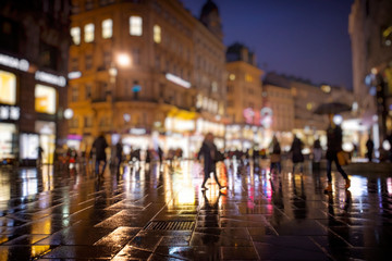 Wall Mural - crowd of people walking on night streets in the city